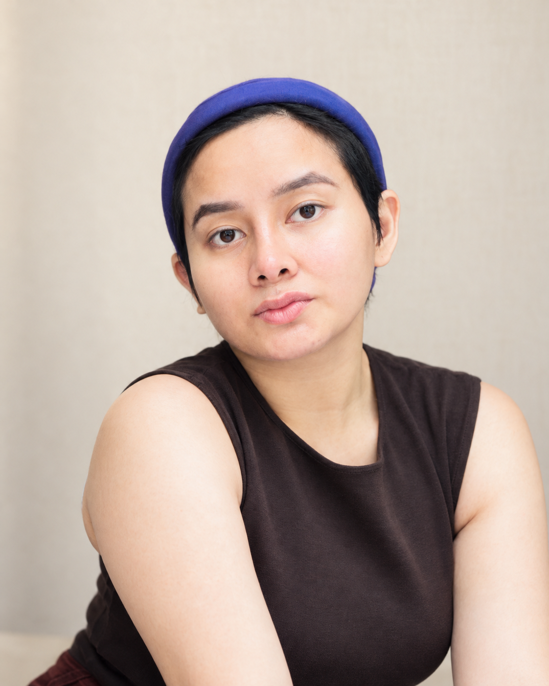 About Me thoughtful portrait with blue headband (1)